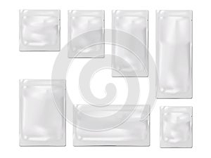 Blank white sachet packet with tear notches. Vector mock-up set. Plastic, paper or foil pouch bag mockup