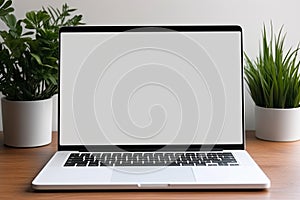 Blank white screen with laptop computer mockup isolated on office desk background