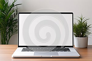 Blank white screen with laptop computer mockup isolated on office desk background