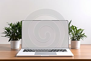 Blank white screen with laptop computer mockup isolated on office desk background