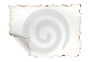 Blank white sheet of paper with burnt edges and a folded corner. Isolated