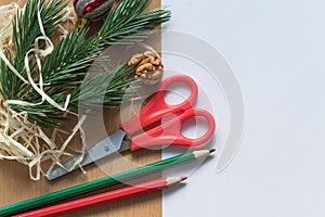 Blank white sheet of paper surrounded with festive christmas decorations. Merry Christmas and Happy New Year. Xmas