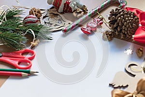 Blank white sheet of paper surrounded with festive christmas decorations. Merry Christmas and Happy New Year. Xmas