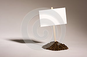 Blank White Sign in Dirt Pile