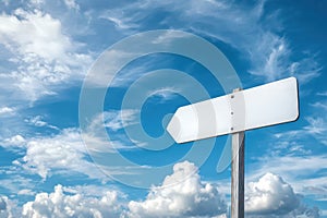 Blank white signpost against blue sky with clouds photo