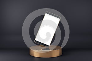 Blank white smartphone display standing on one corner on golden cylinder at abstract dark background. Realistic cell phone mockup