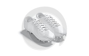 Blank white soccer boots pair with rubber cleats mockup, isolated