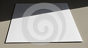 Blank White Square on Table with Light and Shadow