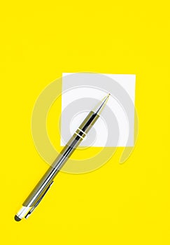 Blank white To Do List Sticker with pen. Searching information on the Internet..Close up of reminder note paper on the yellow