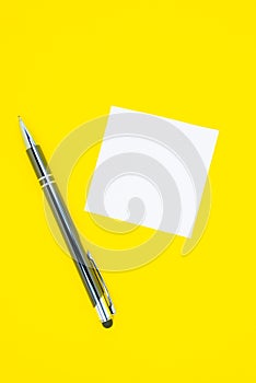Blank white To Do List Sticker with pen. Searching information on the Internet..Close up of reminder note paper on the yellow