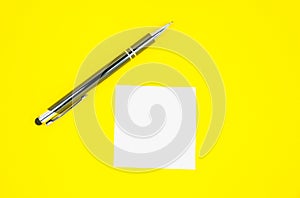 Blank white To Do List Sticker with pen. Searching information on the Internet..Close up of reminder note paper on the yellow