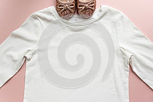 Blank white toddler girl`s long sleeved t-shirt on pink background