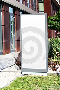 Blank white vertical light box sign mockup photo image. Clear banner on a street mock up template