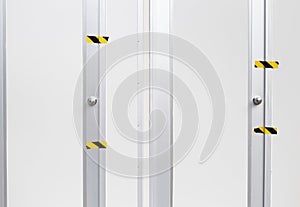 Blank white wall and door background, control room with sticker on whte door