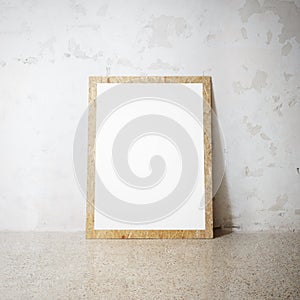 Blank white wooden natural frame on a cocrete wall