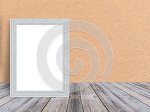 Blank white wooden photo frame at tropical plank wooden floor and wall.