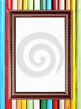 Blank wood frame on colorful bamboo wall