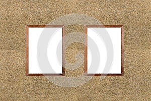 Blank wooden frame picture on sand stone wall background. White board.