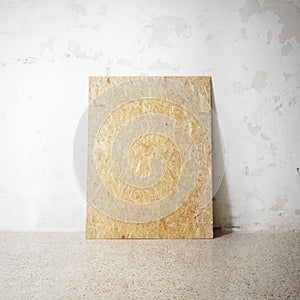 Blank wooden natural frame on a cocrete wall