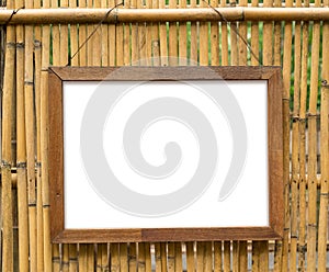 Blank Wooden photo frame with bamboo wall