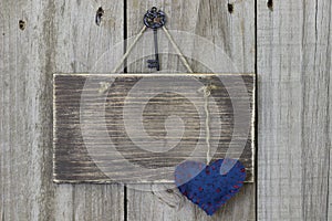 Blank wooden sign with blue calico heart