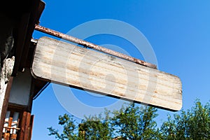 Blank Wooden Sign near House