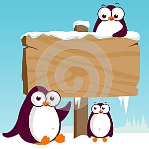 Blank wooden sign on a winter landscape with penguins. Vector Illustration