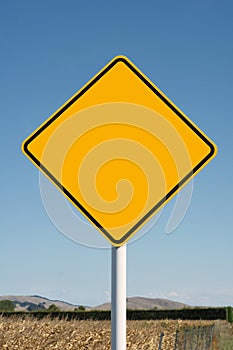 Blank yellow diamond road sign photo