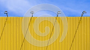 Blank yellow outdoor billboard against blue sky background