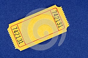 Blank yellow raffle ticket on a blue background