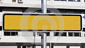 Blank yellow reflective road sign in the street