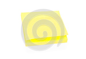 Blank yellow sticky note on block