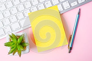 The Blank yellow sticky note on keyboard computer