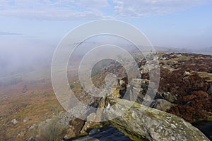 Blanket of fog hides Curbar Edge in the Derbyshire Peak district
