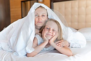 Blanket glad over woman daughter family bed head young eyes, for lying morning in cell from health calm, nap bedtime photo