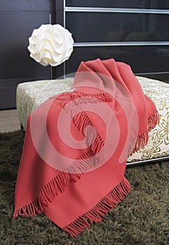 Blanket over an ottoman