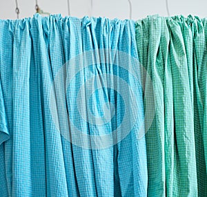 Blankets, pillowcases, sheets are drying out. Hang on the rack, hang the cloth. indoors