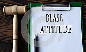 BLASE ATTITUDE - words on a white sheet with a judge\'s gavel