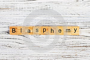 BLASPHEMY word made with wooden blocks concept photo
