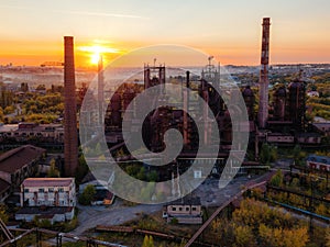 Blast furnace equipment of the metallurgical plant at the sunset, aerial view