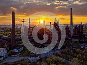 Blast furnace equipment of the metallurgical plant at the sunset, aerial view