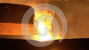 From the blast furnace, the molten liquid metal is poured down the chute into the crucible, steel production.