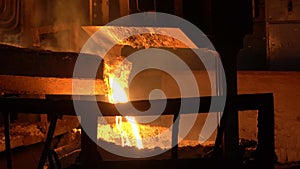 From the blast furnace, the molten liquid metal is poured down the chute into the crucible, steel production.