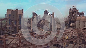 Blast furnace view from the air. Old factory. Aerial view over industrialized city with air atmosphere pollution from