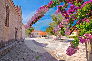 Blato on Korcula island historic stone square town lodge and church view