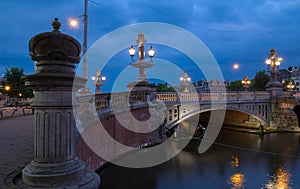 Blauwbrug Blue Bridge over Amstel river in Amsterdam at spring evening, Holland.