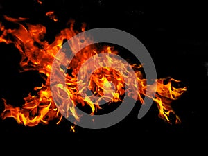 Blaze fire flame texture background. Fire with black smoke and dust. Isolated on black background.