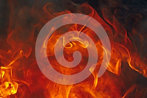 Blazing fire background with tongues of flame