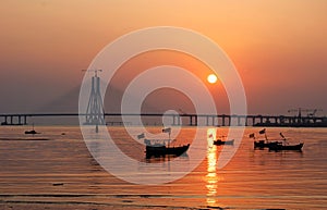 Blazing sunset behind Bandra-Worli Sea Link, also called Rajiv Gandhi Sea Link in Mumbai, India