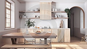 Bleached wooden country kitchen and dining room in white and beige tones. Cabinets and table with chair. Parquet floor. Farmhouse